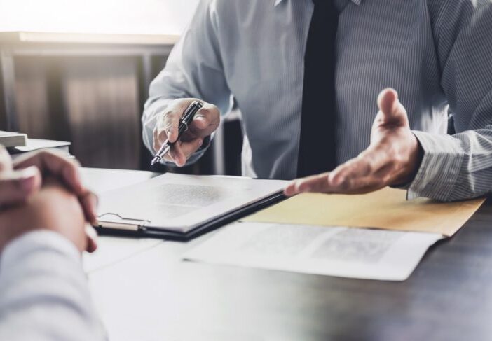 Lawyer having meeting at desk with client