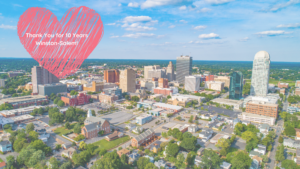 A picture of the Winston-Salem city skyline with a heart over it thanking the city for 10 years in business.
