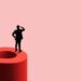 A header image for a blog post entitled "What Counts as Past Relevant Work in a North Carolina Disability Claim?" with a man in a suit standing on a red question mark and looking into a pink background.