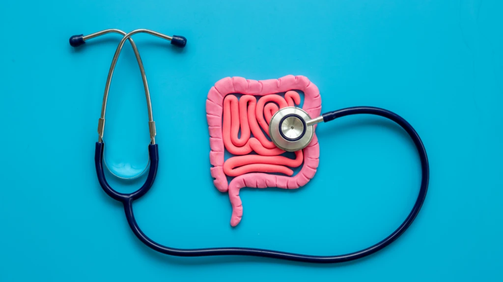 A picture of a colon with a stethoscope on a blue background.