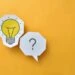 A light bulb and question mark illustration on a yellow background which is the header image for a blog post titled - How Social Security Decides If You Can Still Work in North Carolina