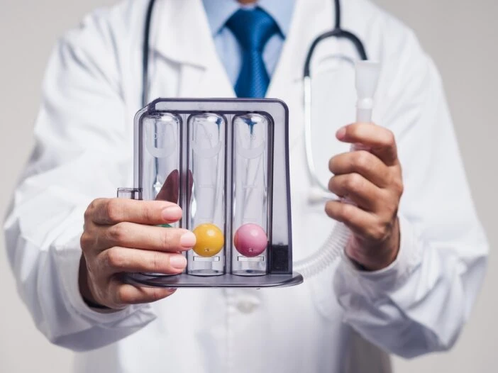 Male doctor in a white lab coat and stethoscope holding a test tube. This is the featured image for a blog post titled - "What Is Residual Functional Capacity in a North Carolina Disability Claim?"